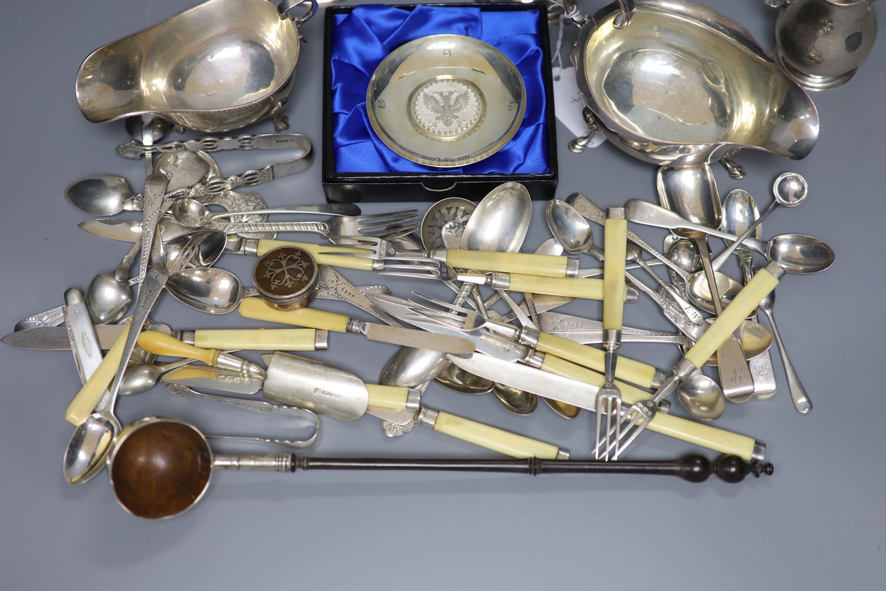 Two George V sauceboats, a pair of George III silver salts, a later sparrow beak cream jug and sundry small silverwares including flatware